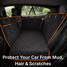 Waterproof dog car hammock seat cover protecting the back seat from mud, pet hair, and scratches during travel.